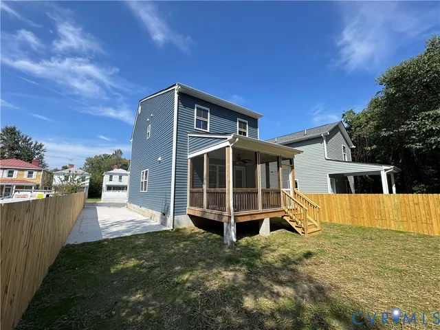 a kitchen with granite countertop a sink stove and refrigerator
