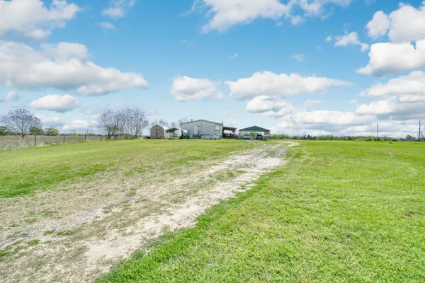 a view of a ocean with beach and an outdoor space