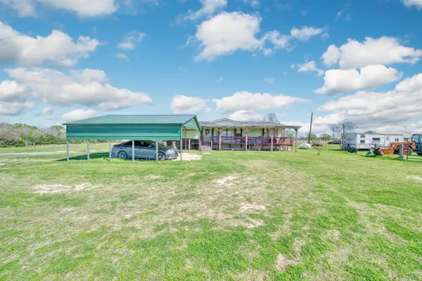 a view of a house with a big yard