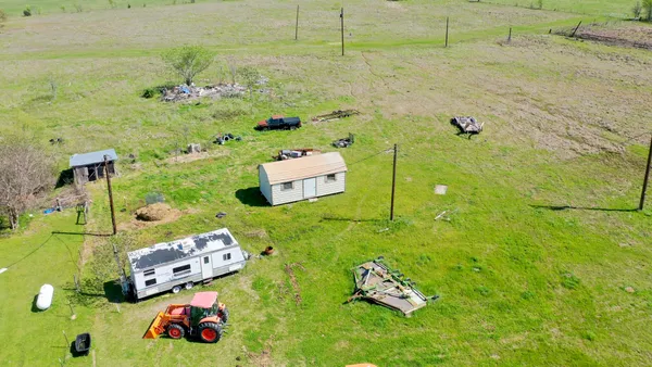 a view of a lake with a yard