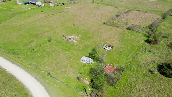 a view of a garden with an ocean