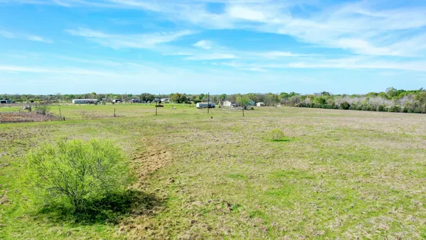 a view of a lake with a big yard