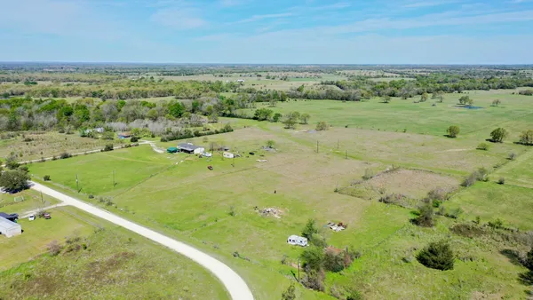 a bathroom with a shower and vanity