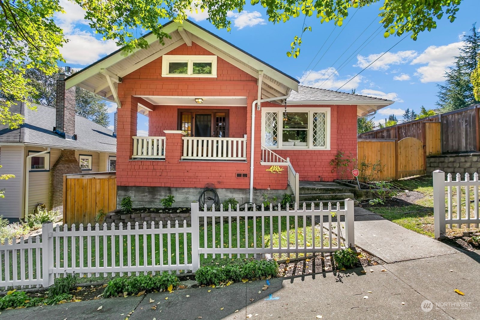 3102 8th Street Everett, WA 98201 - Photo 1 of 22 a front view of a house with a garden