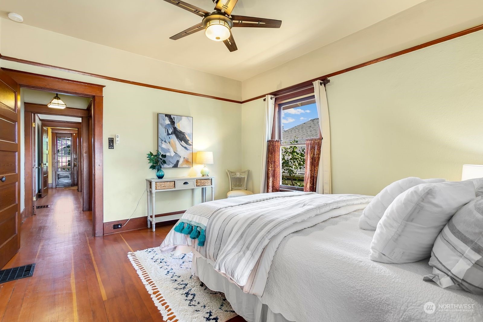 3102 8th Street Everett, WA 98201 - Photo 11 of 22 a bedroom with a bed and a chandelier