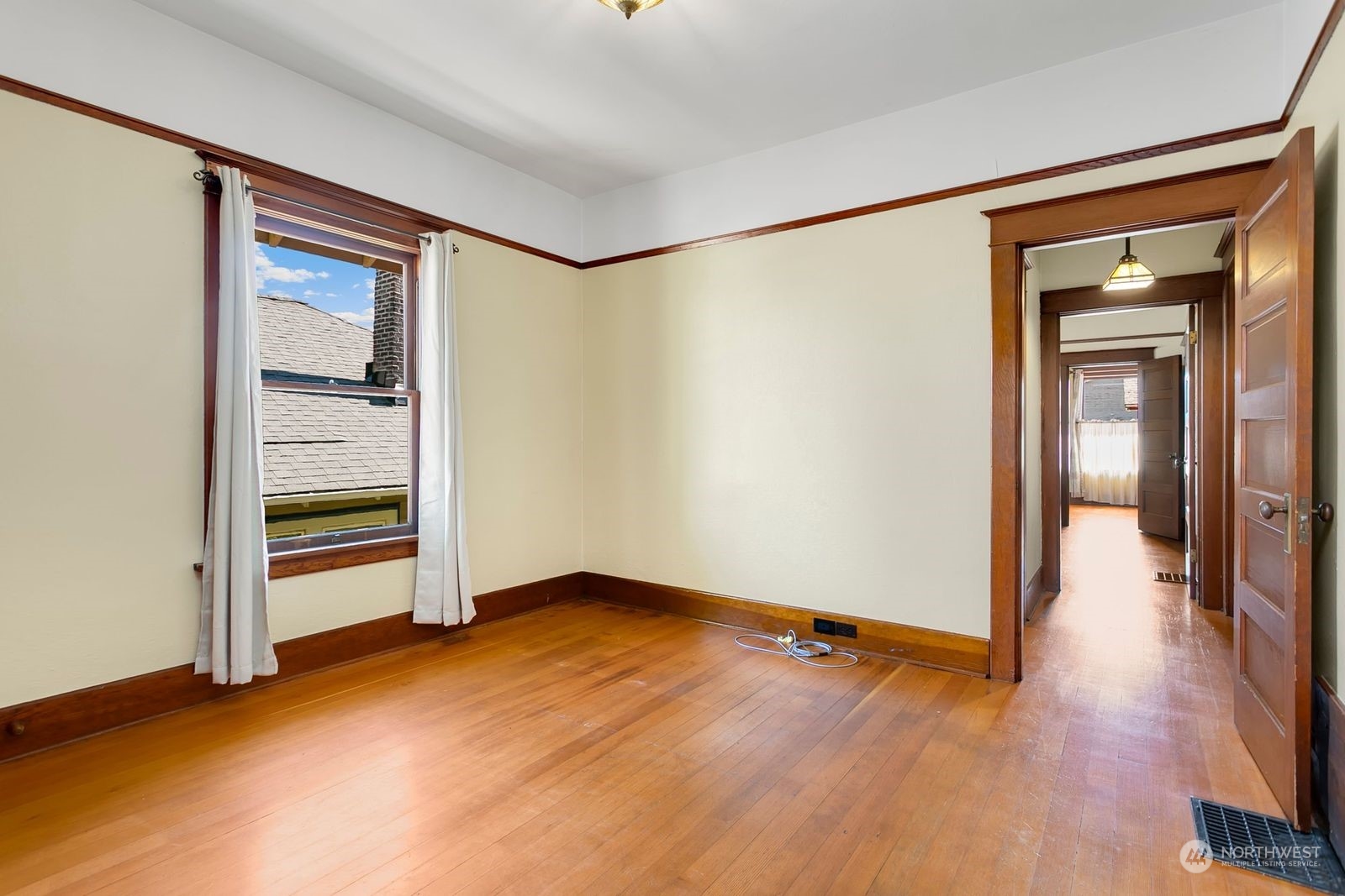 3102 8th Street Everett, WA 98201 - Photo 17 of 22 a view of empty room with wooden floor