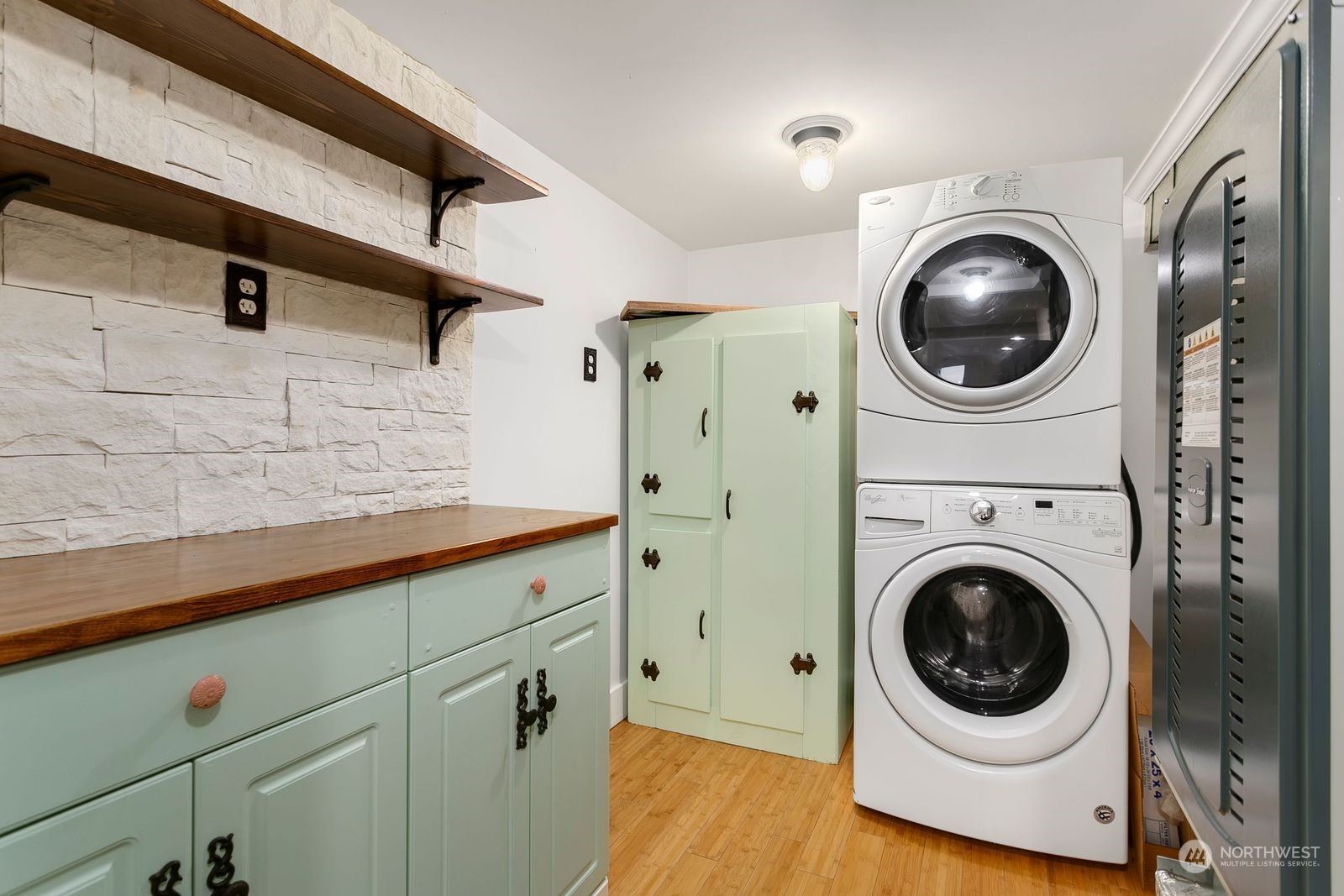 3102 8th Street Everett, WA 98201 - Photo 19 of 22 a view of a hallway with washer and dryer
