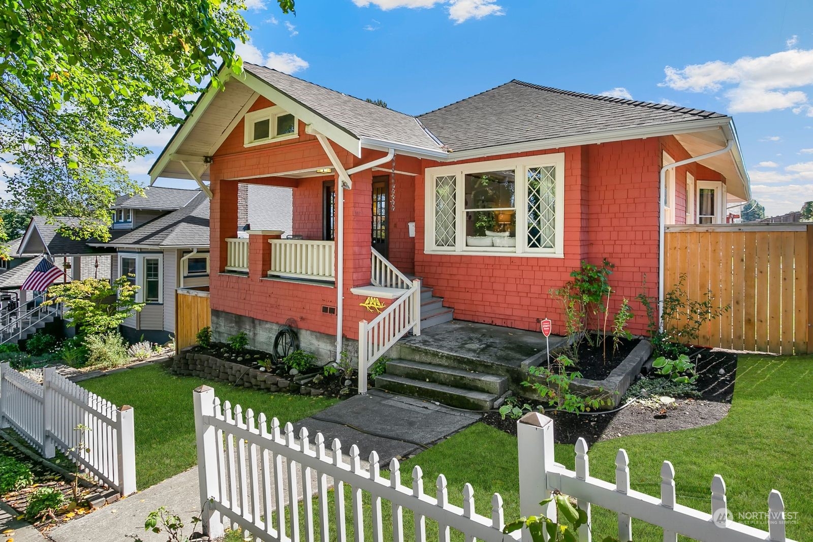 3102 8th Street Everett, WA 98201 - Photo 2 of 22 a front view of a house with a yard and potted plants