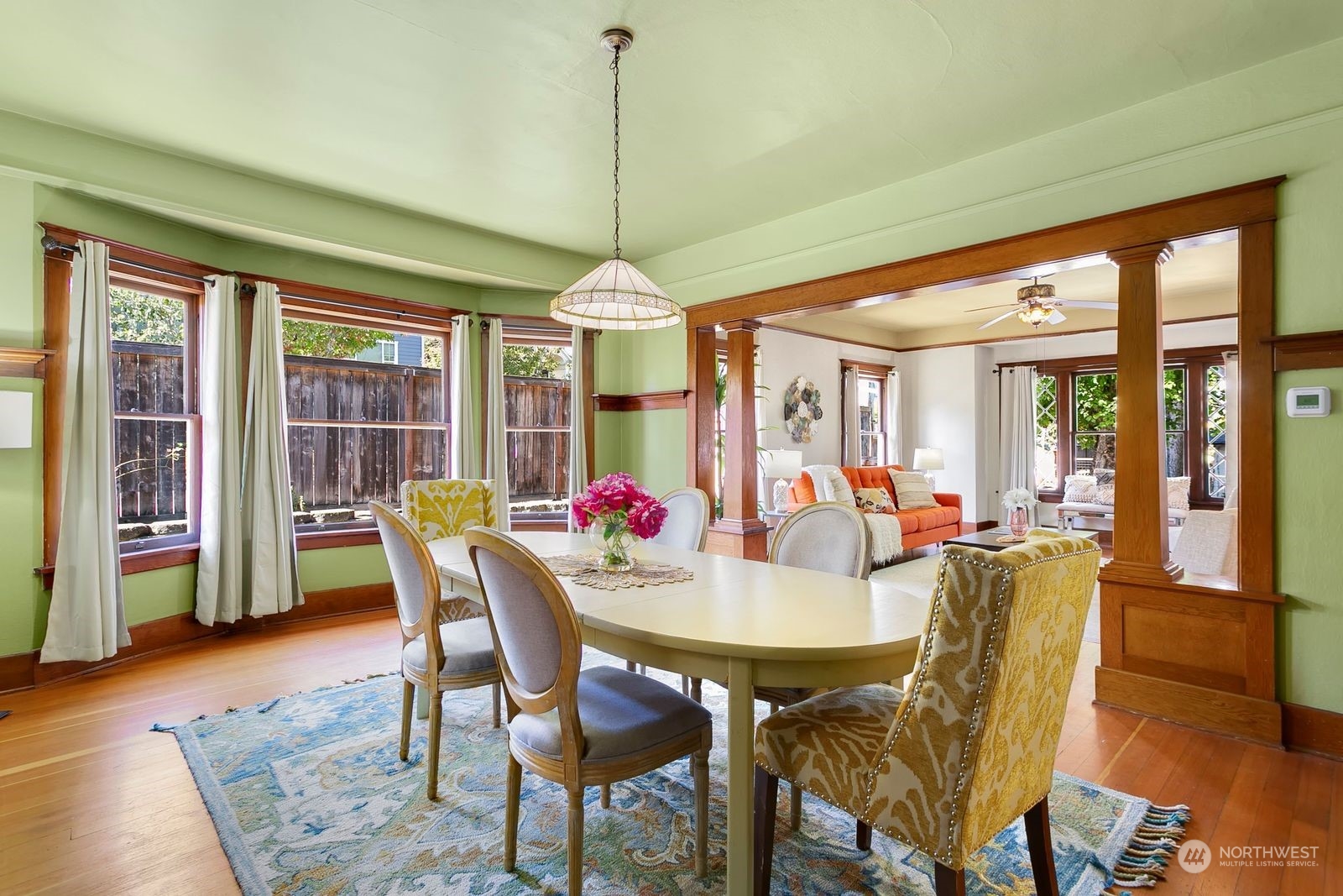3102 8th Street Everett, WA 98201 - Photo 7 of 22 a view of a dining room with furniture window and wooden floor