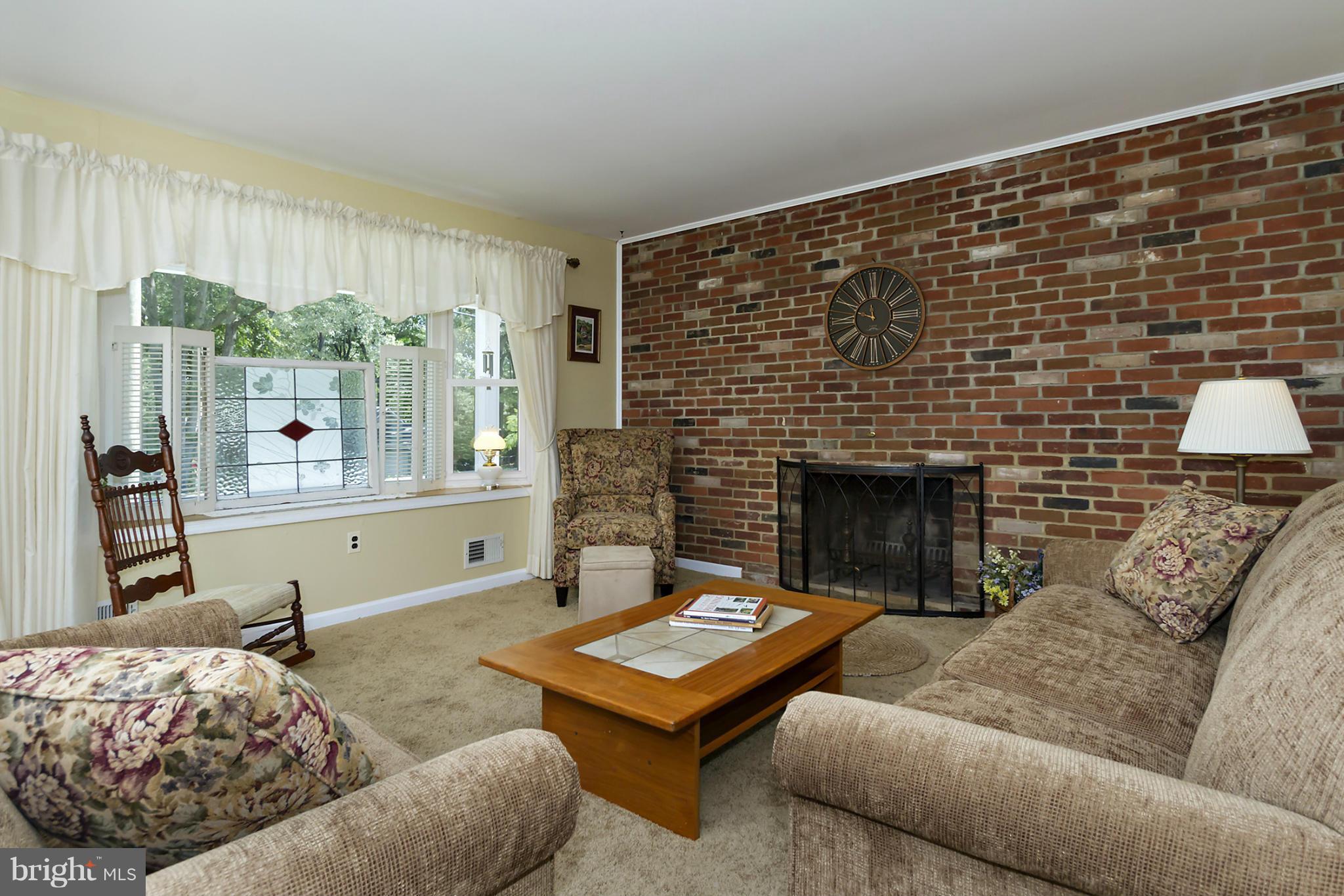 1543 Long Point Road Pasadena, MD 21122 - Photo 3 of 30 LIVING ROOM WITH WOOD BURNING FIREPLACE