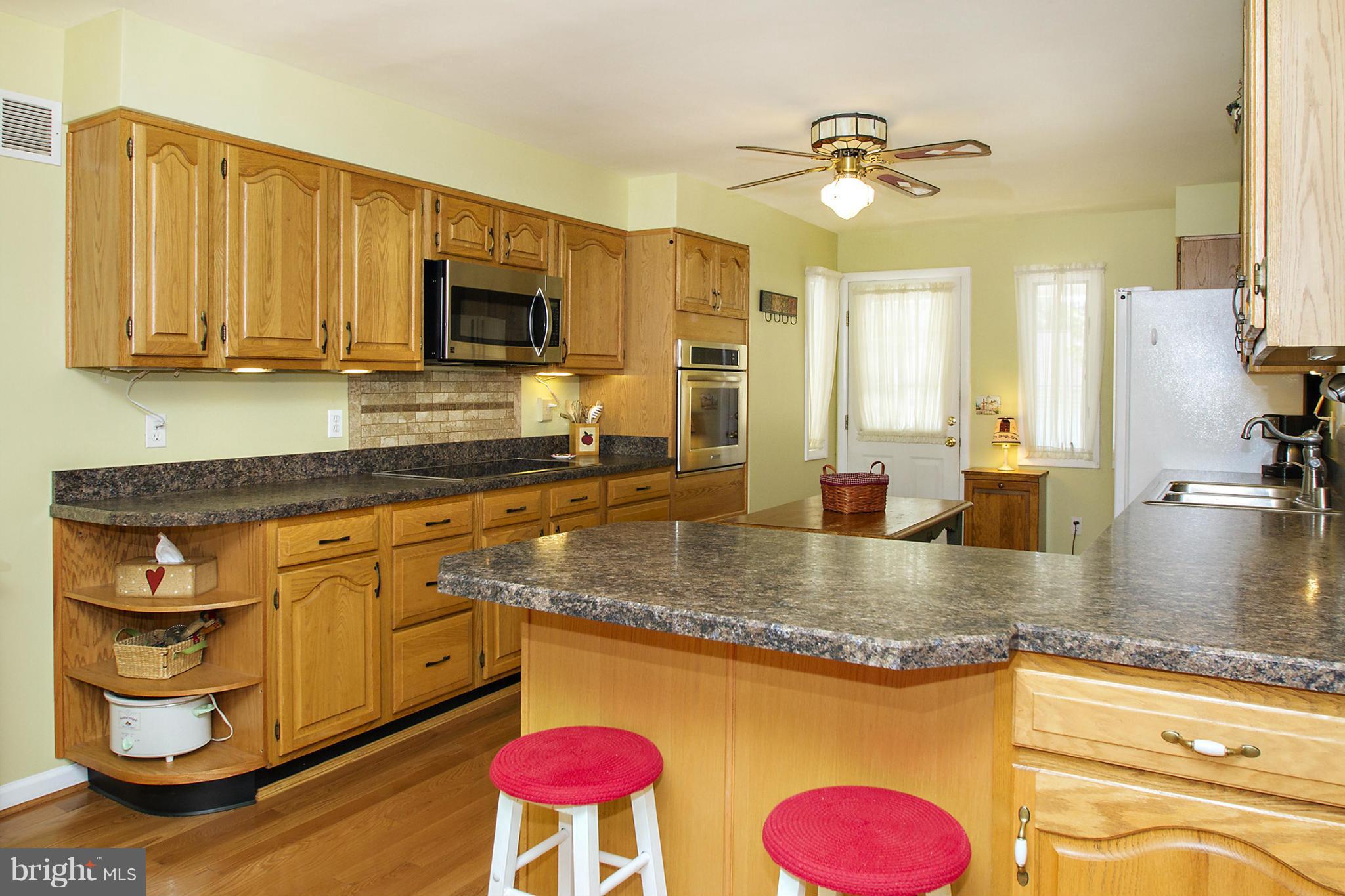 1543 Long Point Road Pasadena, MD 21122 - Photo 6 of 30 SPACIOUS KITCHEN WITH BREAKFAST BAR