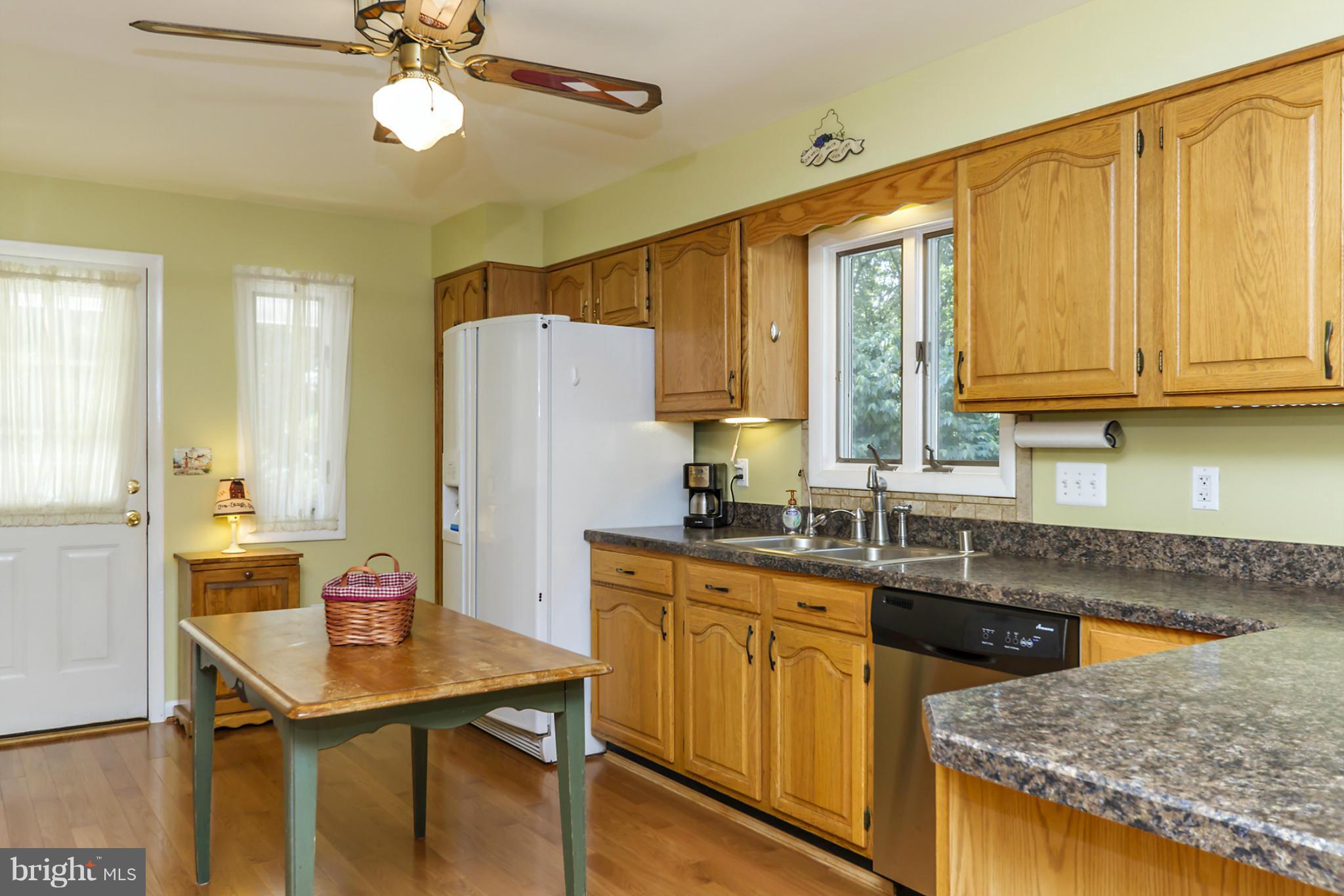 1543 Long Point Road Pasadena, MD 21122 - Photo 7 of 30 KITCHEN - LOTS OF CABINETS AND HARDWOOD FLOORING