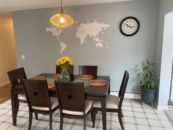 a view of a dining room with furniture and chandelier