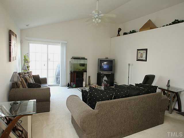 4817 Mocha Lane Raleigh, NC 27616 - Photo 4 of 12 a living room with furniture and a window