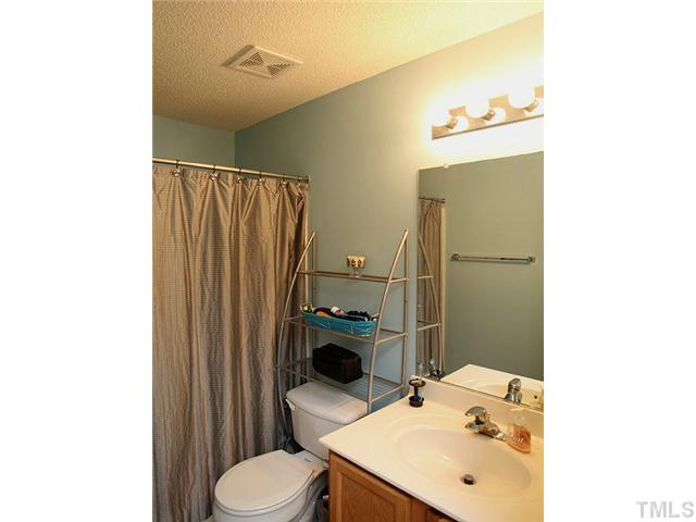 4817 Mocha Lane Raleigh, NC 27616 - Photo 8 of 12 a bathroom with a sink toilet and shower