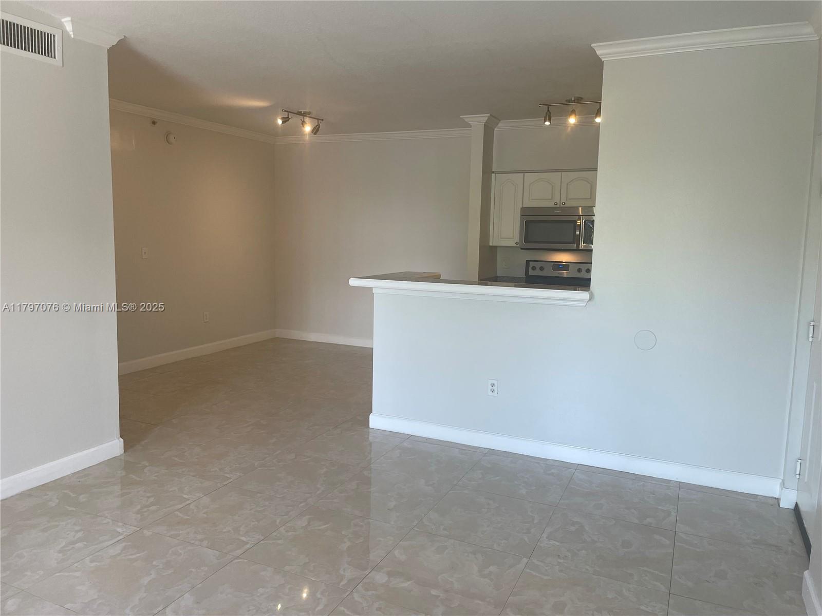 Glenvar Heights Miami, FL 33155 - Photo 2 of 10 a view of a room with wooden floor and electronic appliances