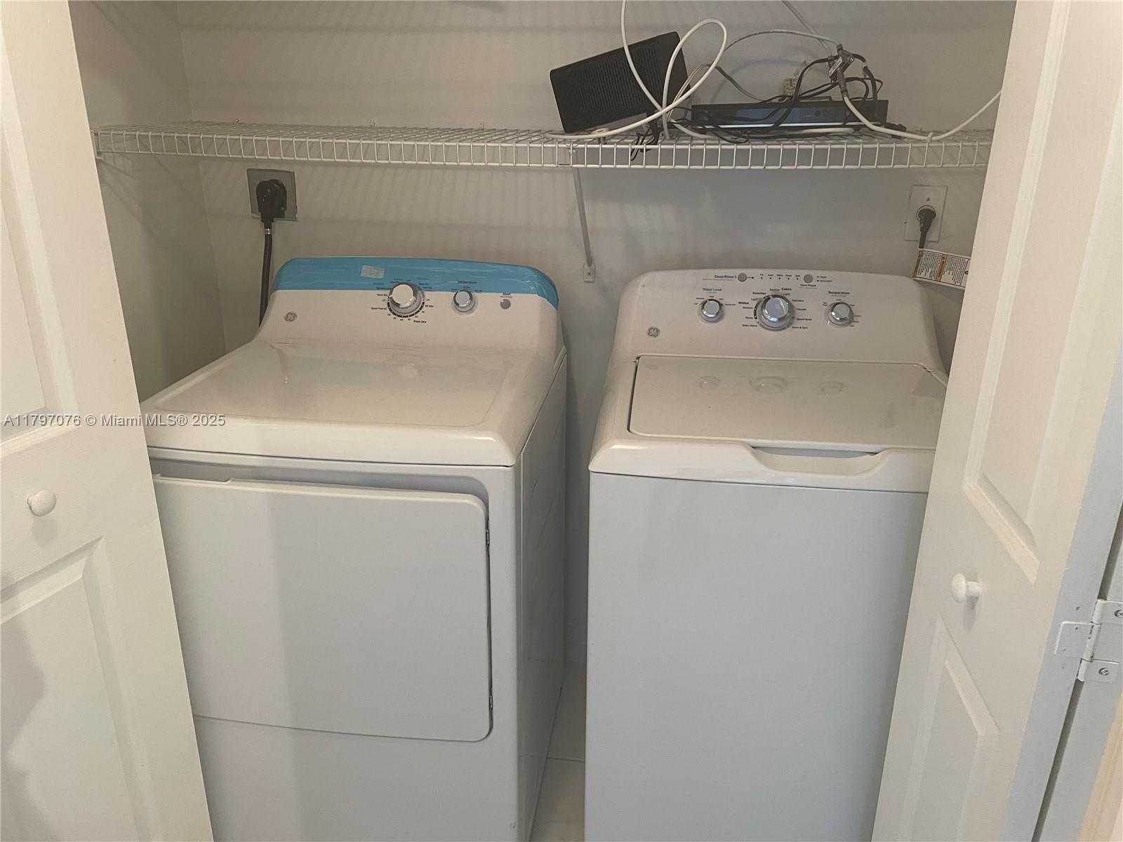 Glenvar Heights Miami, FL 33155 - Photo 8 of 10 a utility room with dryer and washer