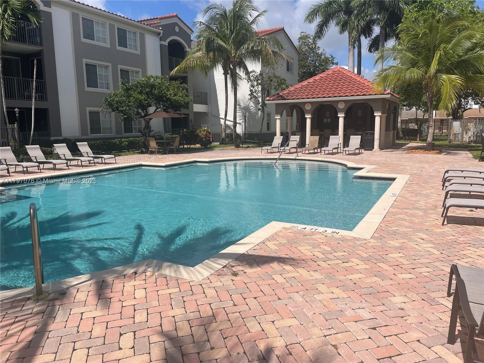 Glenvar Heights Miami, FL 33155 - Photo 9 of 10 a view of a patio with swimming pool table and chairs