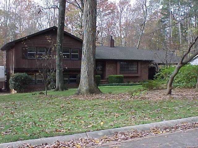 1613 Stonehurst Road Raleigh, NC 27607 - Photo 1 of 1 a house with a tree in front of it