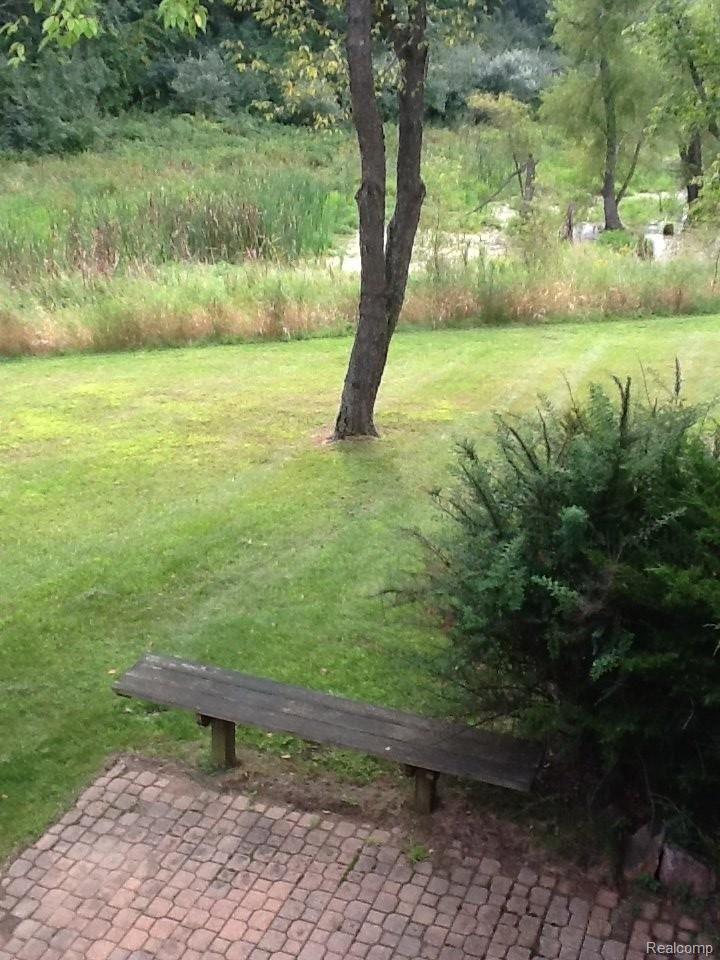 2298 East Coon Lake Road Howell, MI 48843 - Photo 36 of 42 CoonLkPatioToPrivateYard.JPG