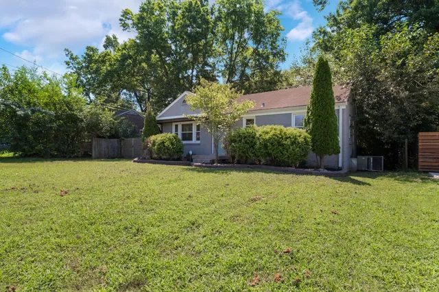 front view of a house with a yard