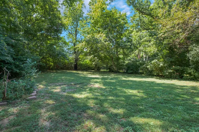 a view of outdoor space with deck and yard