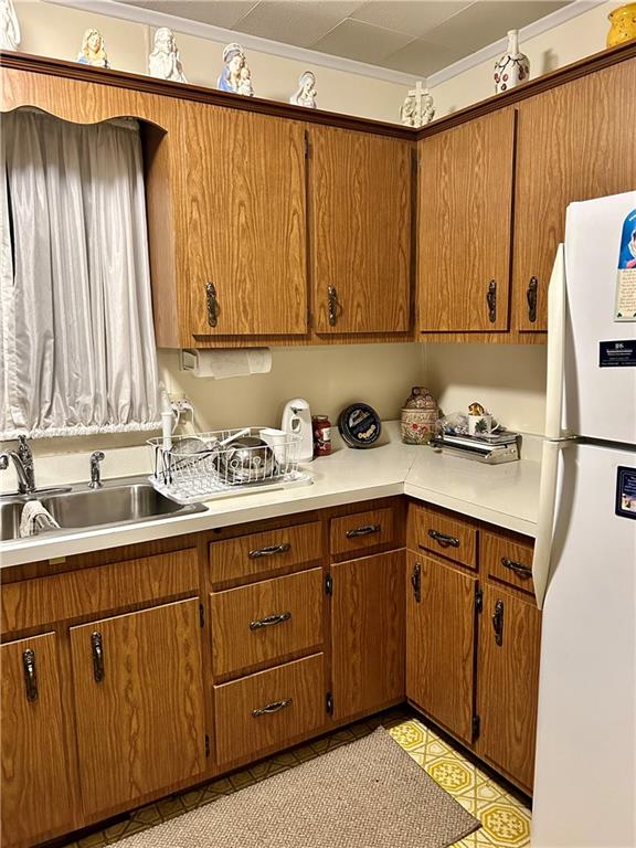 514 South Washington Street Butler, PA 16001 - Photo 13 of 27 a kitchen with a sink a refrigerator and cabinets