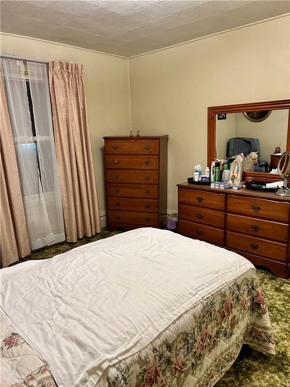 514 South Washington Street Butler, PA 16001 - Photo 16 of 27 a bedroom with a bed and wooden floor