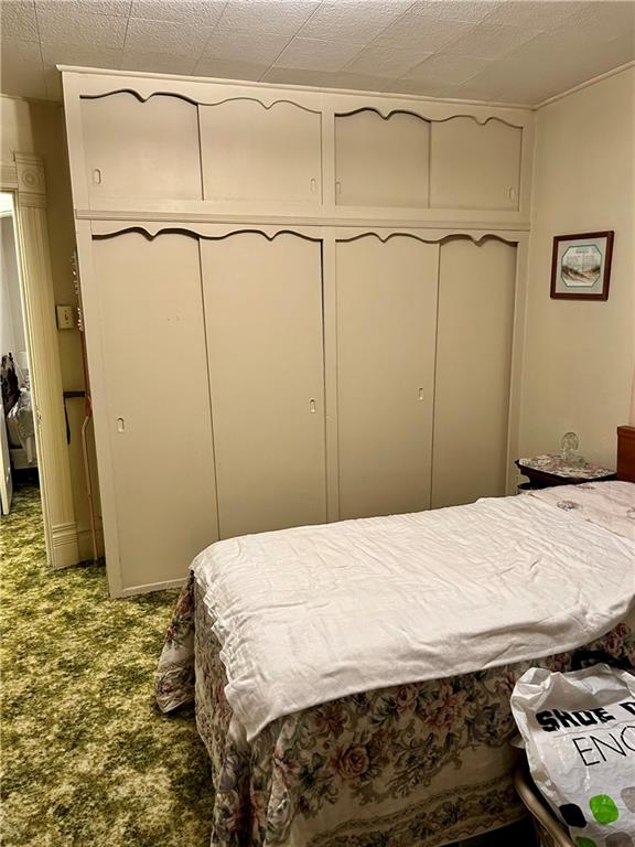 514 South Washington Street Butler, PA 16001 - Photo 18 of 27 a bedroom with a bed and a dresser