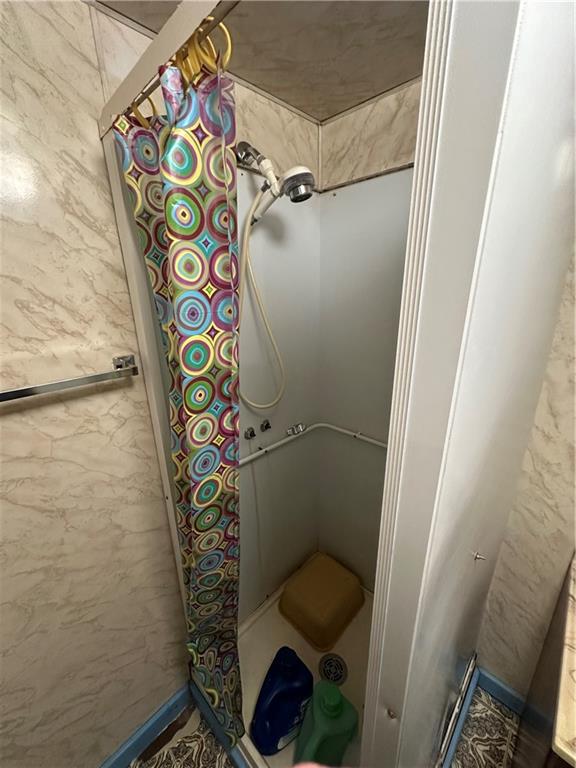 514 South Washington Street Butler, PA 16001 - Photo 23 of 27 a bathroom with a toilet and a shower curtain