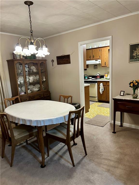 514 South Washington Street Butler, PA 16001 - Photo 9 of 27 a dining room with furniture a chandelier and window