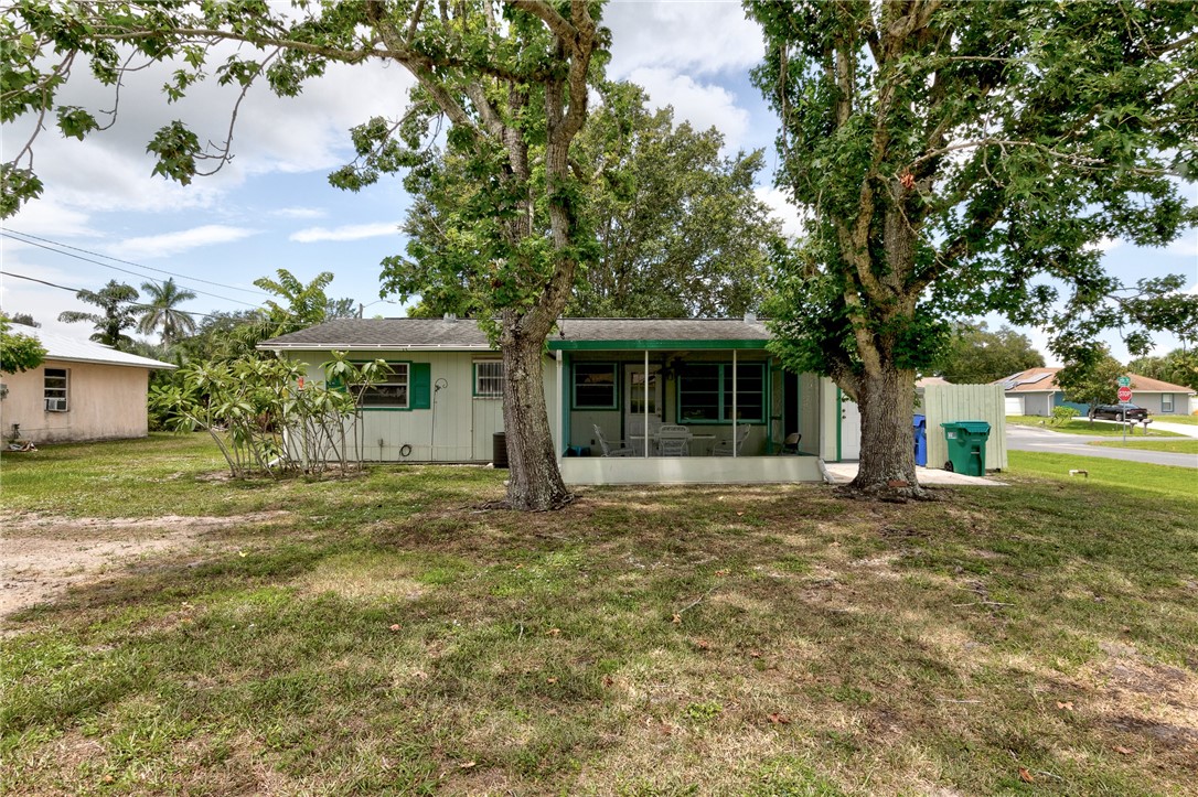 325 Perch Lane Sebastian, FL 32958 - Photo 23 of 26 a front view of a house with a garden