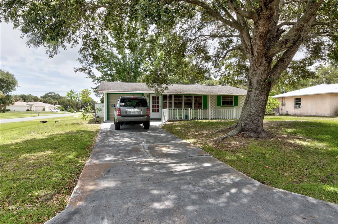 325 Perch Lane Sebastian, FL 32958 - Photo 26 of 26 a front view of a house with a garden