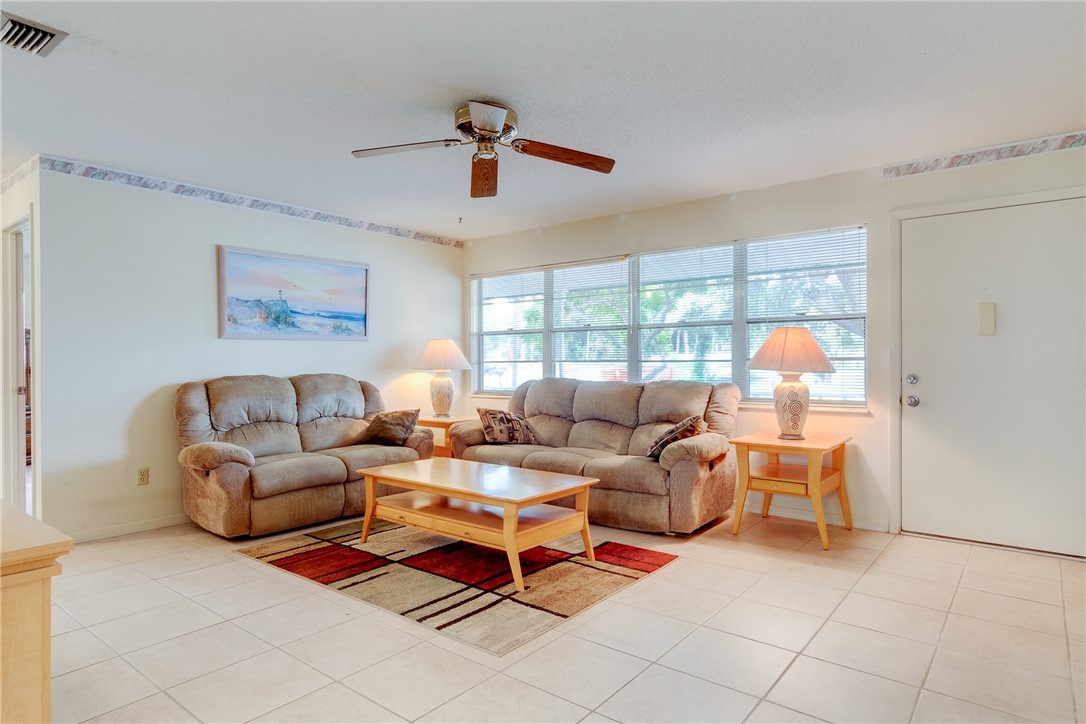 325 Perch Lane Sebastian, FL 32958 - Photo 5 of 26 a living room with furniture and a large window
