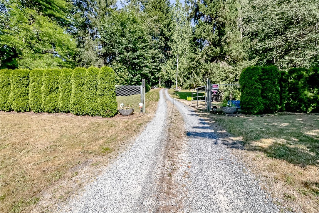 15911 OK Mill Road Snohomish, WA 98290 - Photo 2 of 40 a view of a yard with plants and trees