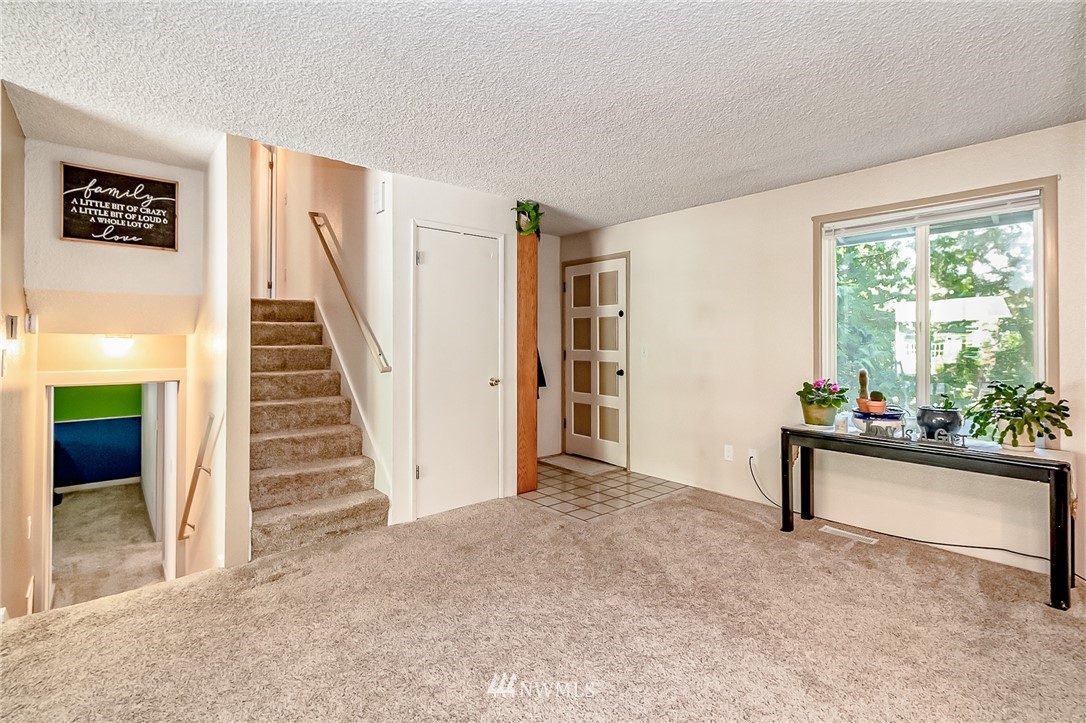 15911 OK Mill Road Snohomish, WA 98290 - Photo 11 of 40 a view of livingroom with furniture and stairs