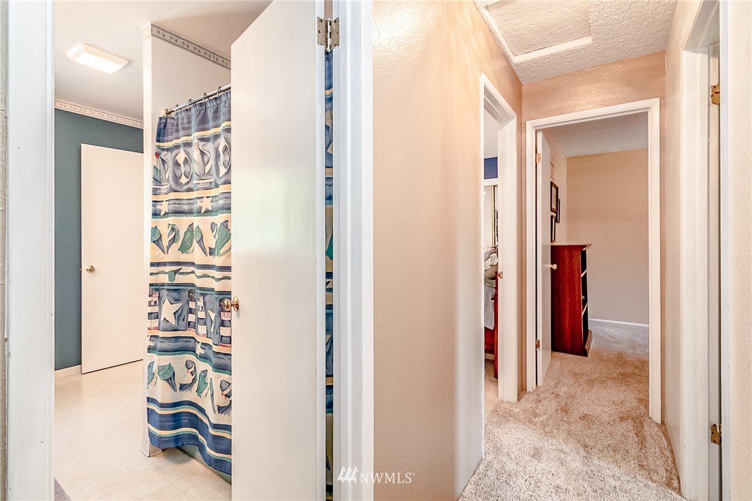15911 OK Mill Road Snohomish, WA 98290 - Photo 12 of 40 a view of a hallway with wooden floor and closet
