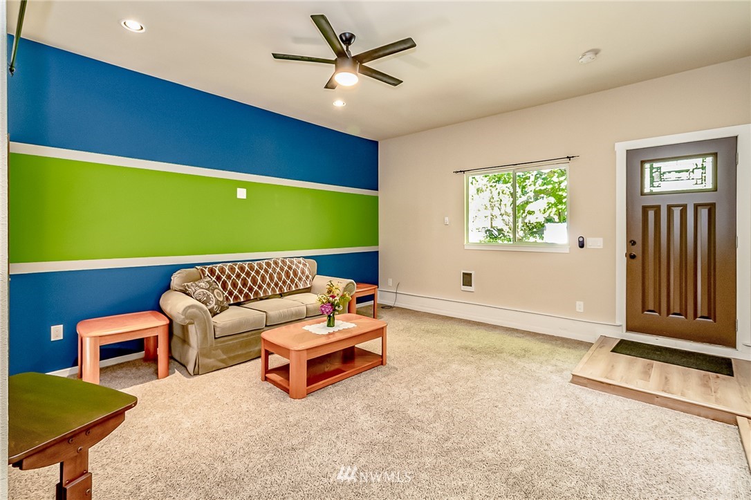 15911 OK Mill Road Snohomish, WA 98290 - Photo 28 of 40 a living room with furniture and a window