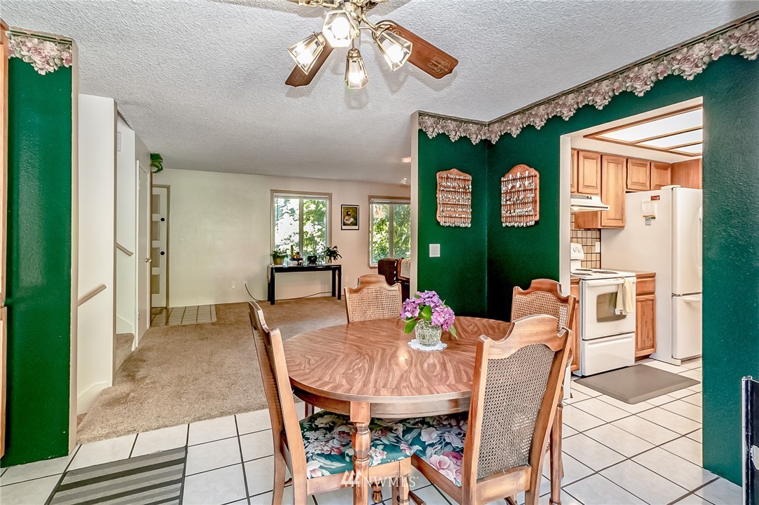 15911 OK Mill Road Snohomish, WA 98290 - Photo 4 of 40 a view of a dining room with furniture and chandelier