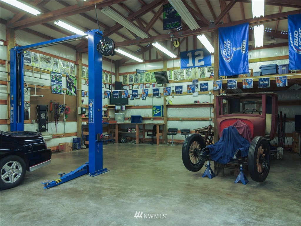 15911 OK Mill Road Snohomish, WA 98290 - Photo 35 of 40 a car is parked in a garage