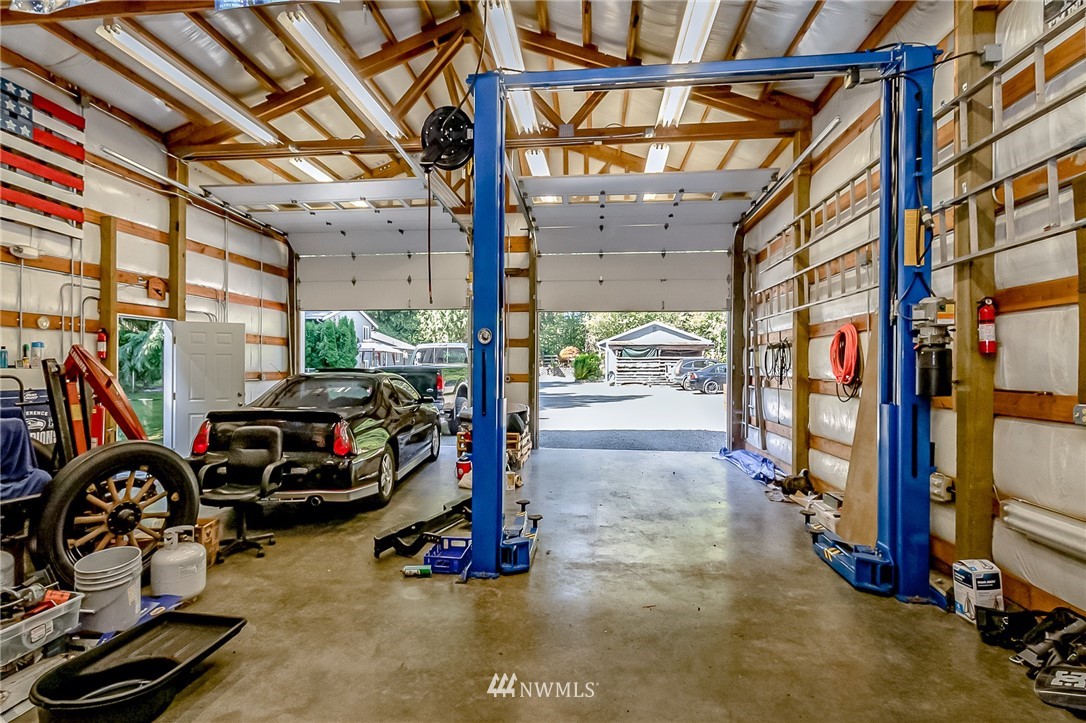 15911 OK Mill Road Snohomish, WA 98290 - Photo 36 of 40 a view of a garage with car parked
