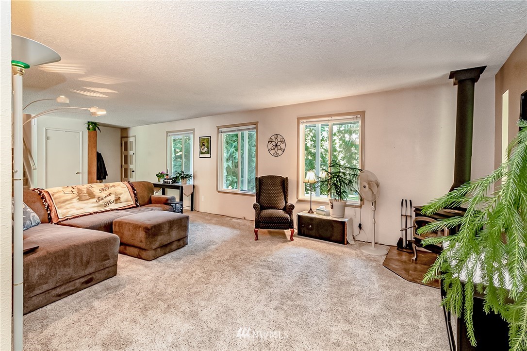 15911 OK Mill Road Snohomish, WA 98290 - Photo 10 of 40 a living room with furniture and a large window