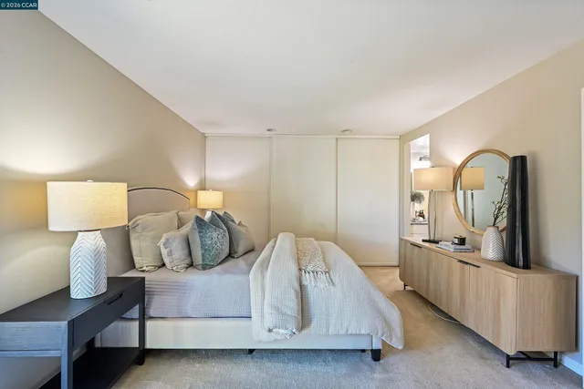 a bedroom with bed and window