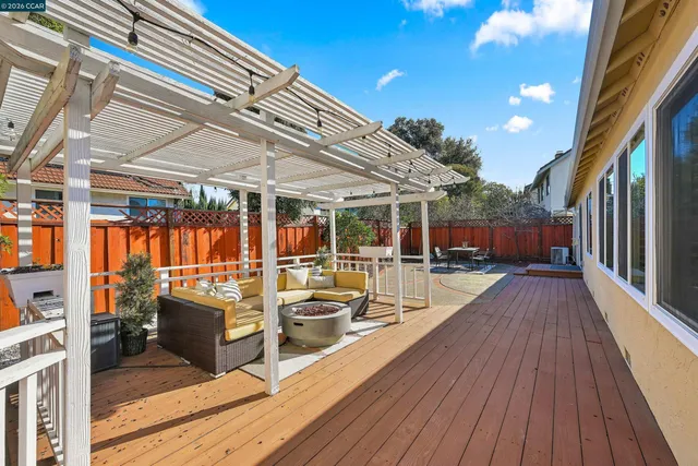 a view of a backyard with sitting area and wooden floor