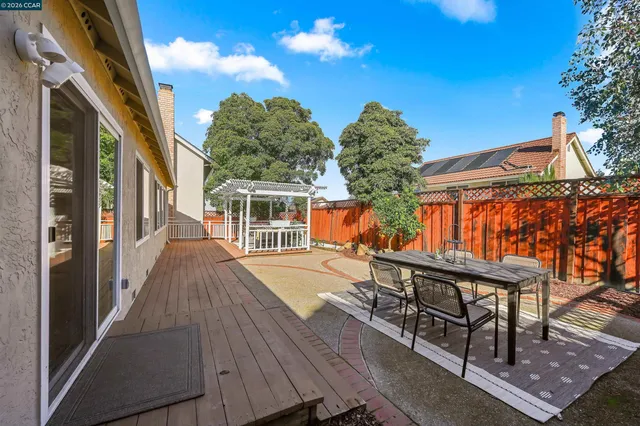 a view of a house with swimming pool and sitting area