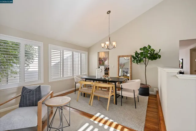 a view of a dining room with furniture and window