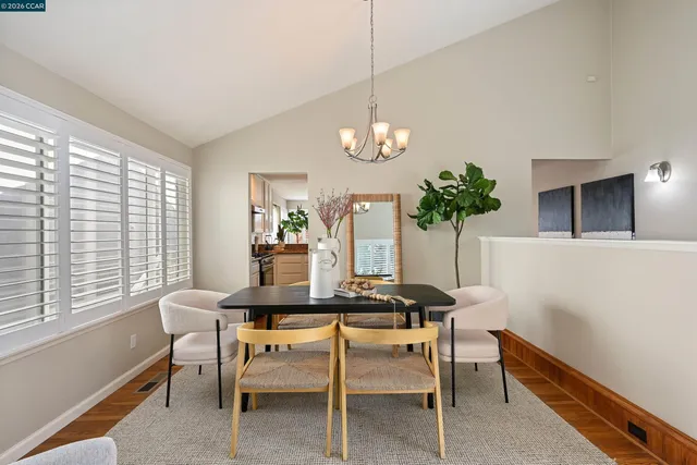 a kitchen with a refrigerator and a stove top oven