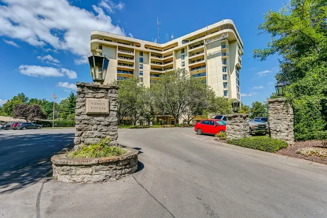 a view of a patio with couches and table and chairs and potted plants