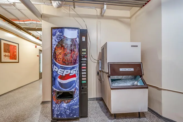 a kitchen with stainless steel appliances granite countertop a sink and a stove