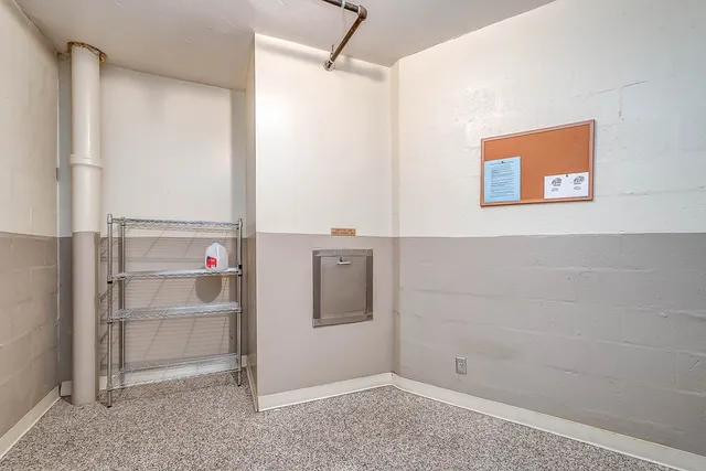 a kitchen with a cabinets and white appliances
